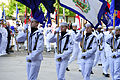 Members of the Navy Ceremonial Guard parade the fifty state flags before a wreath-laying ceremony at the Navy Memorial in Washington D.C.