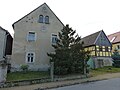 Wohnstallhaus und winkelförmig angebaute Scheune eines Zweiseithofes