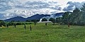 A football match in a community neighboring the mountain