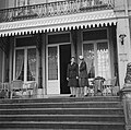 Princess Juliana (right) and her adjunct Rie Stokvis stand on the portico overlooking the front drive