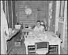 James Wheeler, a miner, sits at a table on his back porch