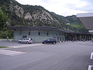 Two-story building with flat roof and rounded wall