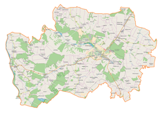 Mapa konturowa powiatu kraśnickiego, na dole po lewej znajduje się punkt z opisem „Janiszów”