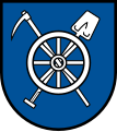 Pickhacke und Spaten (belegt mit einem Rad, Wappen von Möglingen)
