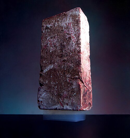 A 2.38g piece of aerogel supports a 2.5kg brick.