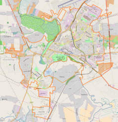 Mapa konturowa Łucka, w centrum znajduje się ikonka zamku z wieżą z opisem „Zamek w Łucku”