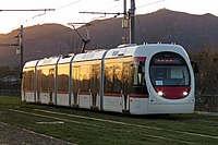 The light rail transit trams on the Xijiao (Western Suburban) line run on standard gauge track and draw power 750V alternating current (AC) electrical power from overhead lines. The Xijiao line uses five-car trams and can reach a top speed of 70 km/h (43 mph).