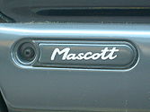 Close view of the "Mascott" logo on the door.