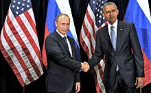 Photo of Obama shaking hands with Vladimir Putin in front of Russian and American flags