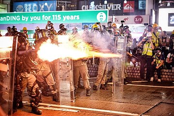 Police shooting tear gas canisters