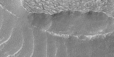 Close view of snout of flow, as seen by HiRISE under HiWish program. Polygonal patterned ground is visible.