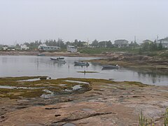 Baie-Johan-Beetz, boats at anchor, sheds and wooden boardwalks[4]