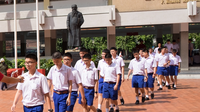 Boy's uniform of Assumption College (Bangkok) with dark blue shorts