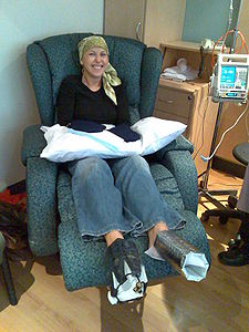 A cancer patient in a head scarf after losing her hair due to chemotherapy