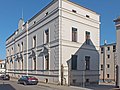 Mühle mit Wohnhaus, Nebengebäude traufständig zur Seumestraße, am Mühlgraben Erweiterungsbau an der ehemaligen Scheune, Außenmauern der Silo- und Speicherbauten am Mühlgraben sowie zwei Toreinfahrten zur Seumestraße