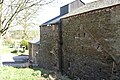 Newland Furnace. The blowing chamber with charging floor above is to the left of the stack. The cement scar is from a roof over the waterwheel.