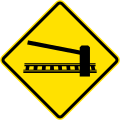 PI-1b Railway crossing ahead with gates or barriers