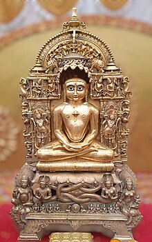 Statue of Parshvanatha seated in yhe lotus posture