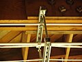 An overhead electrical wire hanger manufactured from two lengths of strut channel and two lengths of threaded rod.