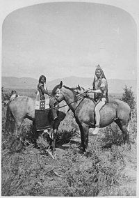 Uinta Ute warrior and his bride on horseback, northwest Utah, 1874