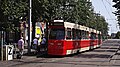 GTL 3097 op lijn 9. De wagen heeft een LVO (LevensVerlengend Onderhoud) ondergaan. Daarvan zichtbaar zijn een botsneus, LED-verlichting en een nieuw kleurenschema. Halte Bierkade/Spui, augustus 2012.