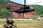 A U.S. Marine Corps Sikorsky CH-53D Sea Stallion helicopter hovers above the ground