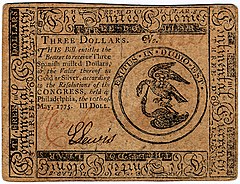 Image of a US “continental” Three-Dollar banknote, with an elaborated border, the left with identifying text and a signature of the issuing official, a seal picturing an eagle preying on a rattlesnake below it.