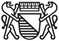 Wappen der Stadt Zürich als städtisches Logo, seit 2005 ohne den unteren Balken. Diese moderne, stilisierte Variante darf nur von öffentlichen Ämtern benutzt werden.