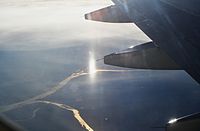 A vertically stretched subsun, seen from an airplane