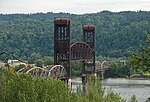 Brown metal bridge with midsection raised