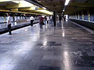 Picture of people wating and leaving at the two island platforms.