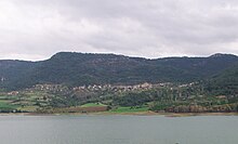 Photo of town from far away, across the water.