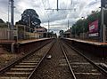 Northbound view of the station platforms from the former Charman Road level crossing, February 2017