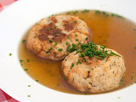 Tiroler Käseknödelsuppe, clear broth served with bread-and-cheese dumplings