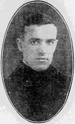 Black and white newspaper photo of a young adult man wearing a military uniform