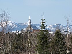 Church of Saint-Hilarion overlooking the village