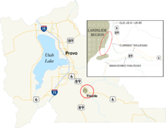 Map showing an area of Utah County circled and enlarged to the southeast of Utah Lake. The enlarged area shows an abandoned rail and highway grades to the west and south of replacement rail and highway grades.