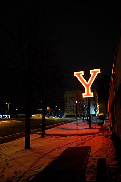 A large lit red "Y" on a snowy night