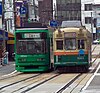 Trams of different construction eras operating concurrently on the Hiroden network in 2005