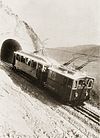 A train of the Renon railway in its first years of operation passing the only tunnel along the now closed rack section