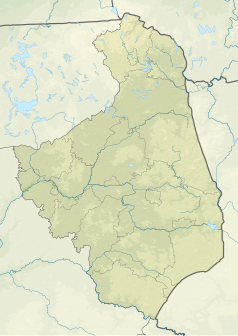 Mapa konturowa województwa podlaskiego, w centrum znajduje się owalna plamka nieco zaostrzona i wystająca na lewo w swoim dolnym rogu z opisem „Jezioro Zygmunta Augusta”