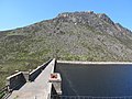 The Ben Crom Dam. Behind the dam is the Ben Crom Reservoir with a capacity of 1,700,000,000 litres. The hill in the background is also known as Ben Crom