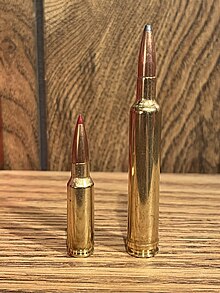 Rifle cartridges side by side. On the left is the 6.5mm Grendel. On the right is the 6.5-300 Weatherby Magnum.