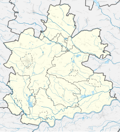 Mapa konturowa powiatu buskiego, blisko lewej krawiędzi znajduje się punkt z opisem „Kostki Małe”