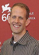 A picture of Pete Docter smiling towards the camera