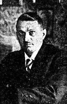 Grainy black and white headphones photograph of Ninko Perić at or before age 42, he has a moustache and short hair. he is wearing a suit.