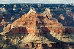 Wescogame Formation slopes directly below upper-vertical-cliff of Esplanade Sandstone-(below Hermit Formation and white Coconino Sandstone prominence). Isis Temple, with complete Supai Group for Grand Canyon; (Pakoon Limestone miles westward in Grand Canyon, and Nevada)