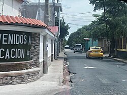 A photograph of a street leading into the center of Core Relocation #1