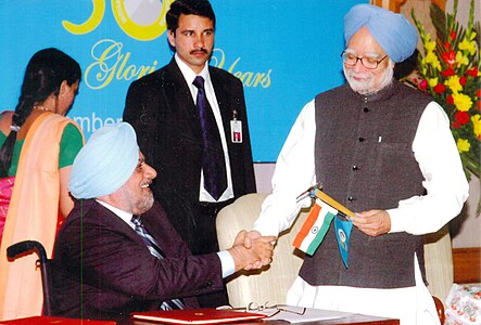 Ahluwalia with former Prime Minister of India - Manmohan Singh.