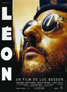 Image of Jean Reno as Léon: he is bearded and wearing sunglasses looking upwards.